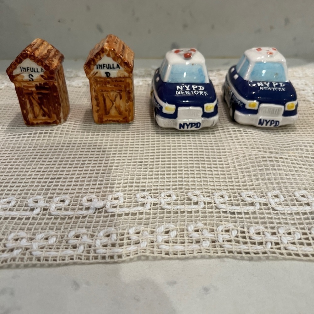 2 sets of Salt and Pepper Shakers. Minature OutHouse S&P and NYPD police car S&P